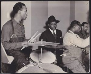 Count Basie orchestra practice, 1941. L to R: Jo Jones, Count Basie, Walter Page.